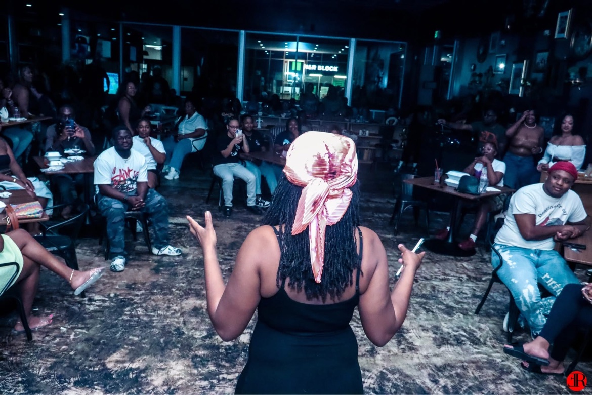 A performer engaging the crowd from the stage